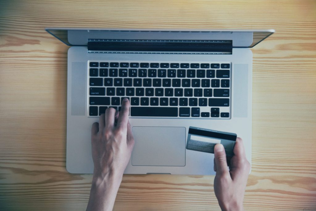 Paying with a credit card on a laptop